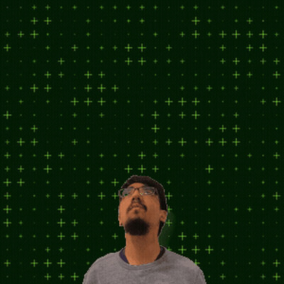 a man with a beard looks up at a glowing number 27