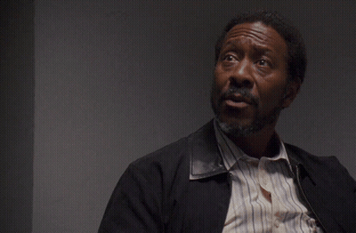 A Man With A Beard Looks Up At The Words No One Cares GIF