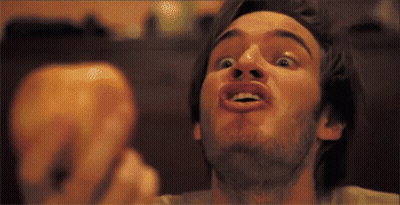 A Man With A Beard Making A Funny Face With His Mouth Open GIF