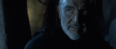 A Man With A Beard Says " Do N't Tempt Me " In A Dark Room GIF