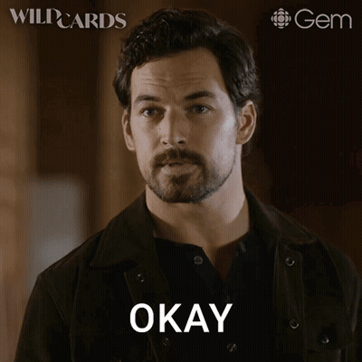 A Man With A Beard Says Fair Enough On A Poster GIF
