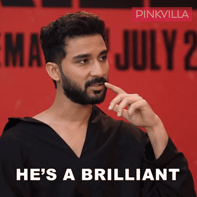 A Man With A Beard Says He 'S A Brilliant On A Red Background GIF