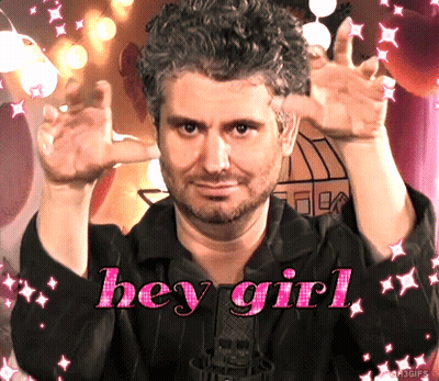 A Man With A Beard Says Hey Girl In Pink GIF