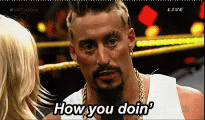 A Man With A Beard Says How You Doin While Talking To A Woman GIF