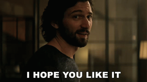 A Man With A Beard Says " I Hope You Like It " In Front Of Him GIF