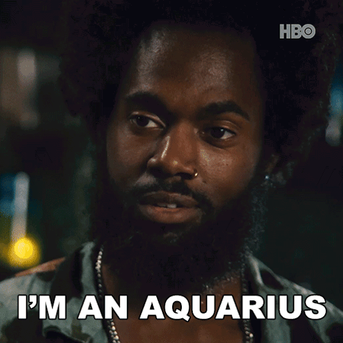 A Man With A Beard Says " I 'M An Aquarius " In Front Of A Hbo Logo GIF
