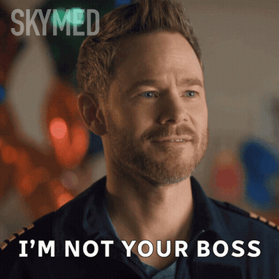 A Man With A Beard Says " I 'M Not Your Boss " In Front Of Balloons GIF