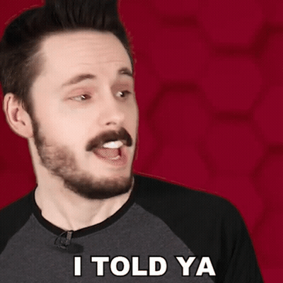 A Man With A Beard Says I Told Ya In Front Of A Red Background GIF