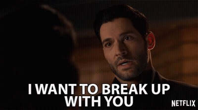 A Man With A Beard Says " I Want To Break Up With You " In Front Of A Woman GIF