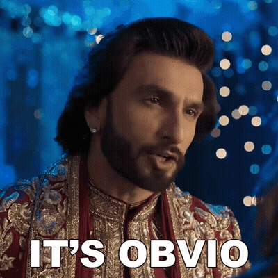 A Man With A Beard Says It 'S Obvio In Front Of A Blue Background GIF