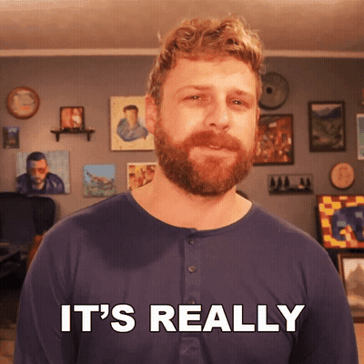A Man With A Beard Says It 'S Really In Front Of A Wall Of Paintings GIF