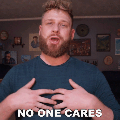 A Man With A Beard Says No One Cares With His Hands GIF