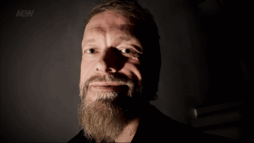 A Man With A Beard Says " See You Soon " In Front Of His Face GIF