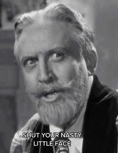 A Man With A Beard Says Shut Your Nasty Little Face In A Black And White Photo GIF