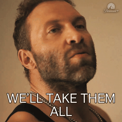 A Man With A Beard Says " We 'Ll Take Them All " In Front Of A Paramount Logo GIF