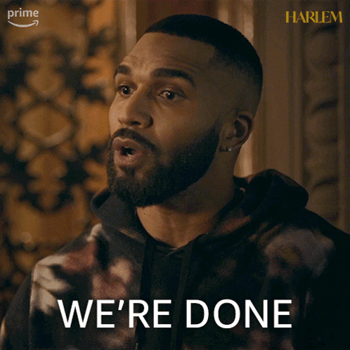 A Man With A Beard Says We 'Re Done In Front Of A Harlem Poster GIF