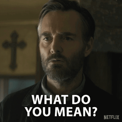 A Man With A Beard Says " What Do You Mean " In Front Of A Cross GIF