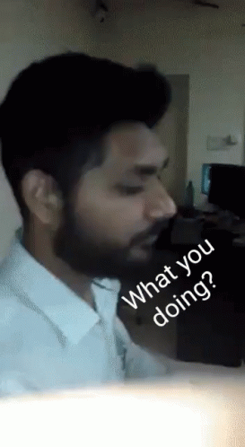A Man With A Beard Says " What You Doing " GIF