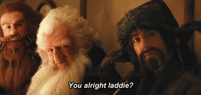A Man With A Beard Says " You Alright Laddie " To Another Man GIF