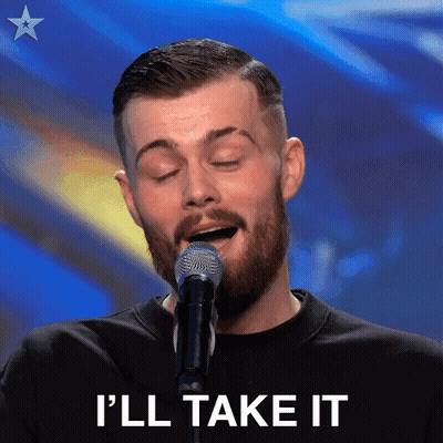 A Man With A Beard Singing Into A Microphone With The Words I 'Ll Take It Below Him GIF
