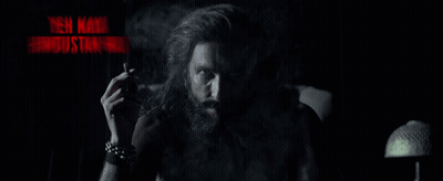 A Man With A Beard Smoking A Cigarette With The Words Yeh Naya Hindustan Hai In Red Letters GIF