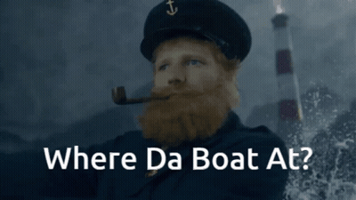 A Man With A Beard Smoking A Pipe With The Words Where Da Boat At GIF