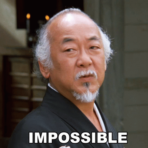 A Man With A Beard Stands In Front Of A Sign That Reads Impossible GIF