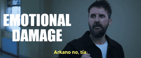 A Man With A Beard Stands In Front Of A Sign That Says " Emotional Damage " GIF