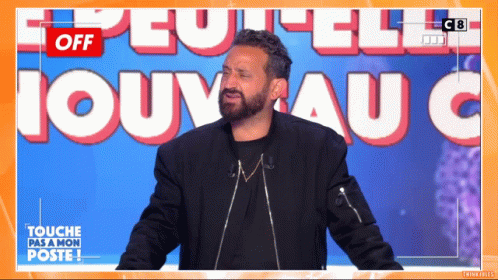 A Man With A Beard Stands In Front Of A Sign That Says " Off " GIF