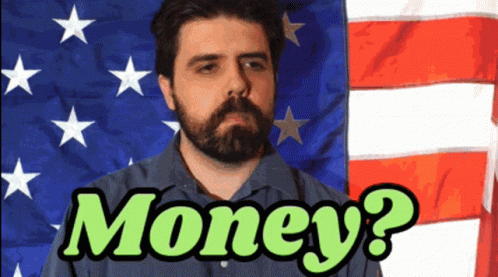 A Man With A Beard Stands In Front Of An American Flag With The Words Money Written In Green GIF