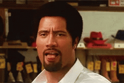 A Man With A Beard Sticking Out His Tongue GIF