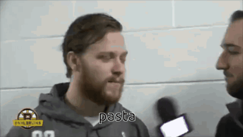 A Man With A Beard Talks Into A Microphone And The Word Pasta Is Visible GIF