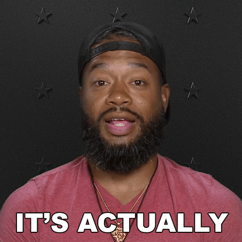 A Man With A Beard Wearing A Baseball Cap And A Red Shirt Says Working Right Now GIF