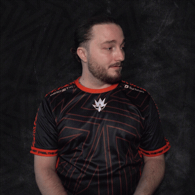 A Man With A Beard Wearing A Black And Red Shirt With A Maple Leaf On The Sleeves GIF