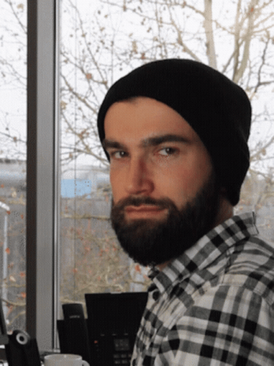 A Man With A Beard Wearing A Black Beanie GIF