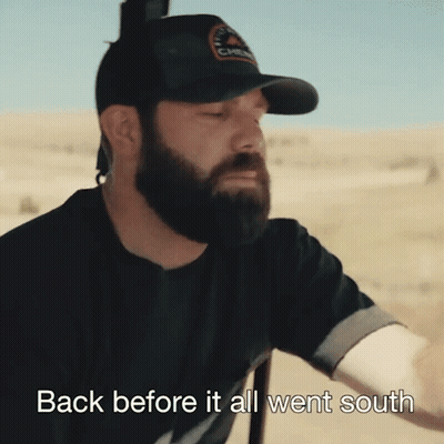 A Man With A Beard Wearing A Black Hat With The Words Back Before It All Went South On The Bottom GIF
