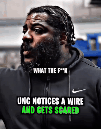 A Man With A Beard Wearing A Black Nike Jacket GIF