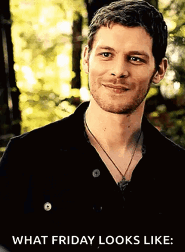 A Man With A Beard Wearing A Black Shirt And A Necklace Is Smiling And Says What Friday Looks Like GIF