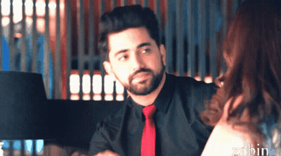 A Man With A Beard Wearing A Black Shirt And Red Tie GIF