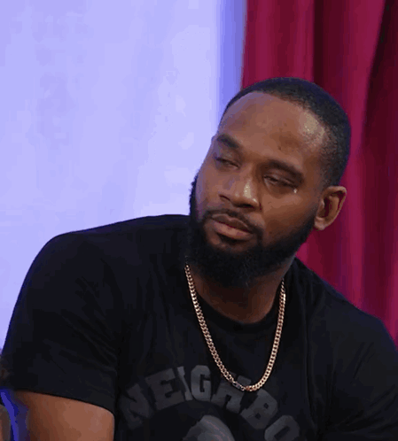 A Man With A Beard Wearing A Black Shirt That Says Neighbor On It GIF