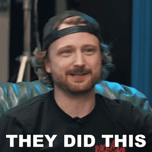 A Man With A Beard Wearing A Black Shirt That Says They Did This On It GIF