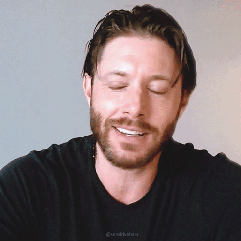 A Man With A Beard Wearing A Black Shirt With Sensitiveham Written On The Bottom GIF
