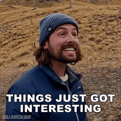 A Man With A Beard Wearing A Blue Jacket And A Beanie Says " Things Just Got Interesting " GIF