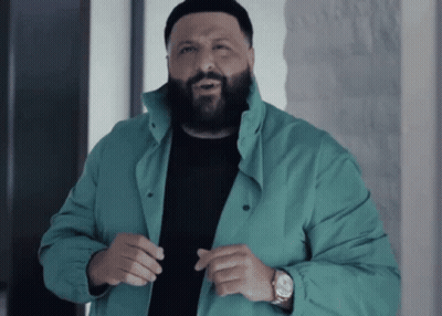 A Man With A Beard Wearing A Blue Jacket And A Watch GIF