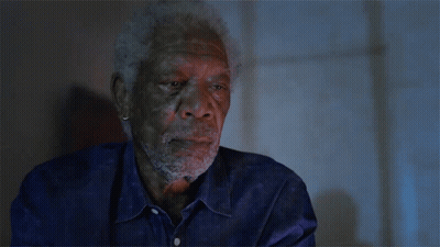 A Man With A Beard Wearing A Blue Shirt GIF