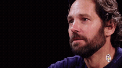 A Man With A Beard Wearing A Blue Shirt GIF