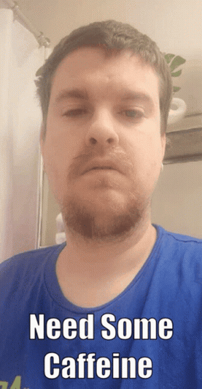 A Man With A Beard Wearing A Blue Shirt Says Need Some Caffeine GIF