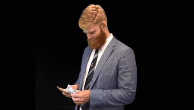 A Man With A Beard Wearing A Blue Suit And Tie GIF