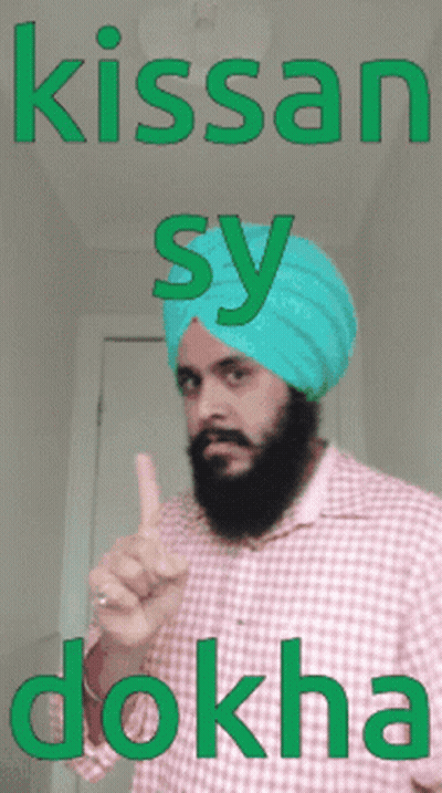 a man with a beard wearing a blue turban with the words kissan sy dokha on it