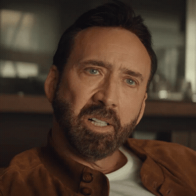 A Man With A Beard Wearing A Brown Leather Jacket GIF